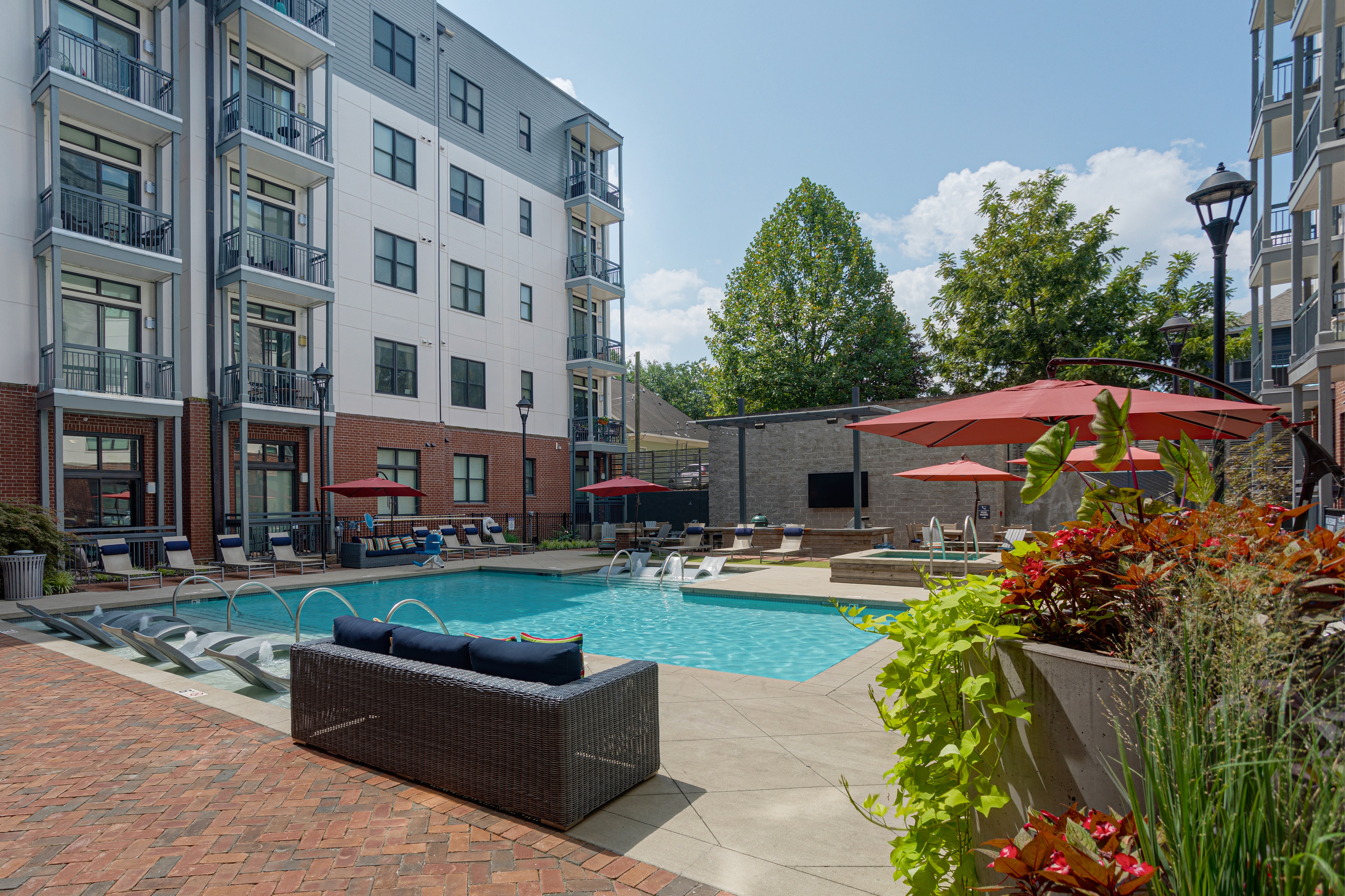 our apartments have a pool and lounge areas with umbrellas