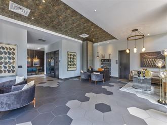Leasing Office and Clubhouse with White Armchairs on Area Rug with Coffee Tables Leasing Office and Clubhouse with White Armchairs on Area Rug with Coffee Tables at Peyton Stakes, Germantown, Nashville, 37208