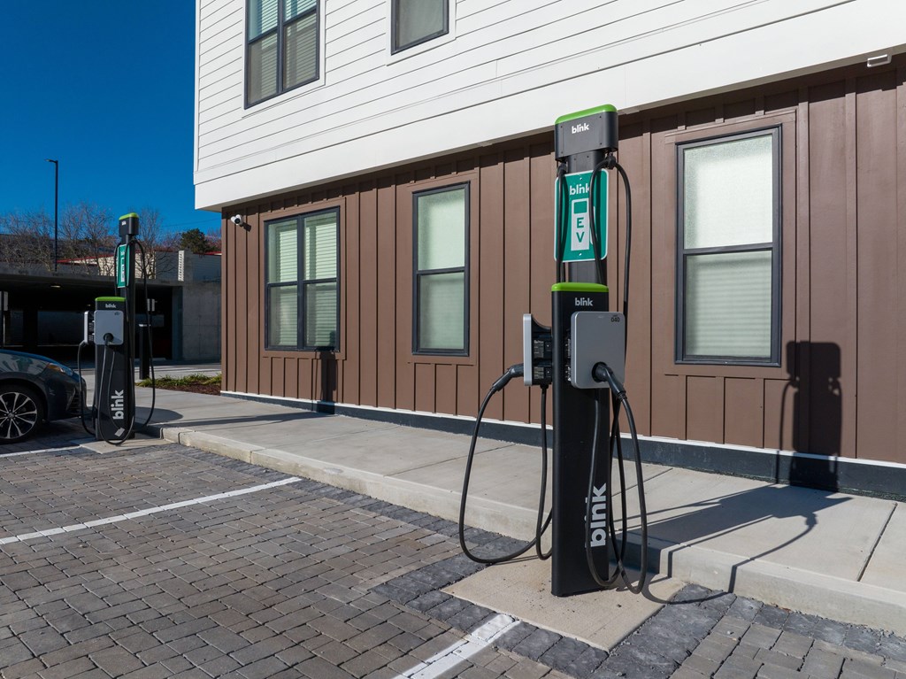 A Blink charging station is located outside a building.
