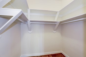 closet with white shelving at Tivoli Gardens Apartments in Washington, DC