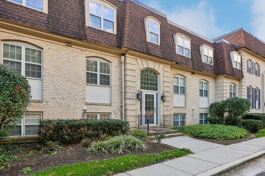 A building with a brick facade and a red roof.