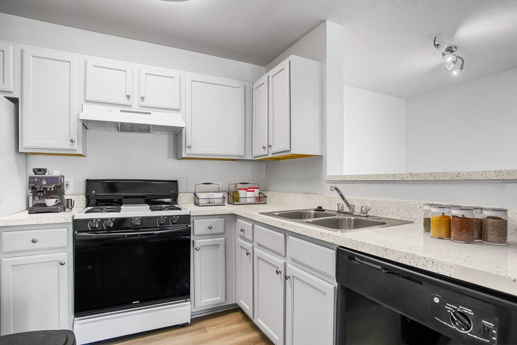 A Kitchen with White Cabinets at Governors Green, Bowie, MD