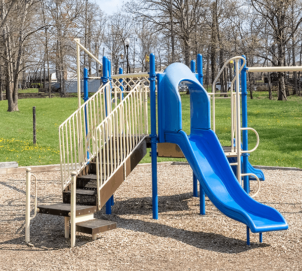 A playground with a blue slide and a wooden staircase at Dutch Village Apartments, Baltimore, MD, 21234