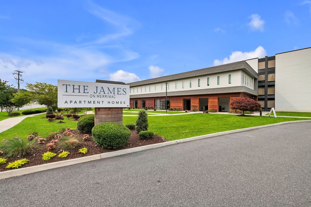 The James apartment homes on Mercer is a modern building with a landscaped front yard.