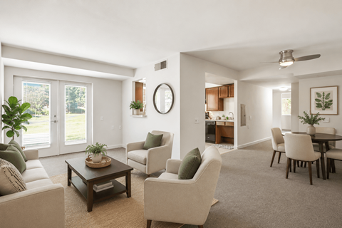 A living room with a sofa, chairs, and a coffee table.