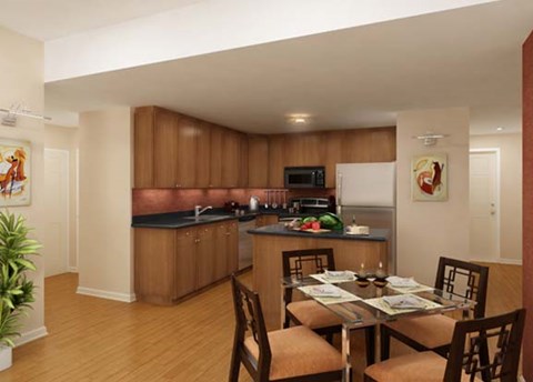 A kitchen with a table set for four.