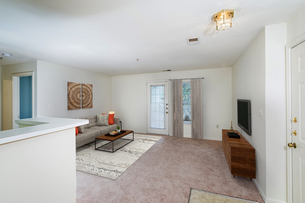 living room photo with couch, coffee table, and TV at Governors Green, Maryland, 20716