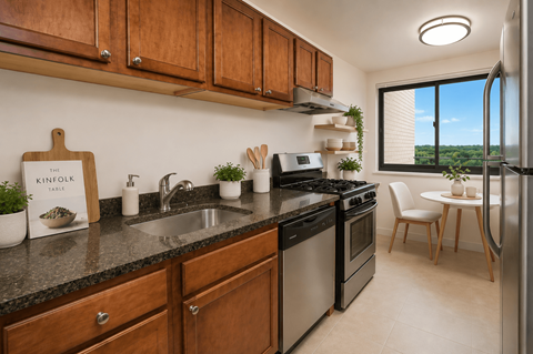 A kitchen with wooden cabinets and a black countertop.