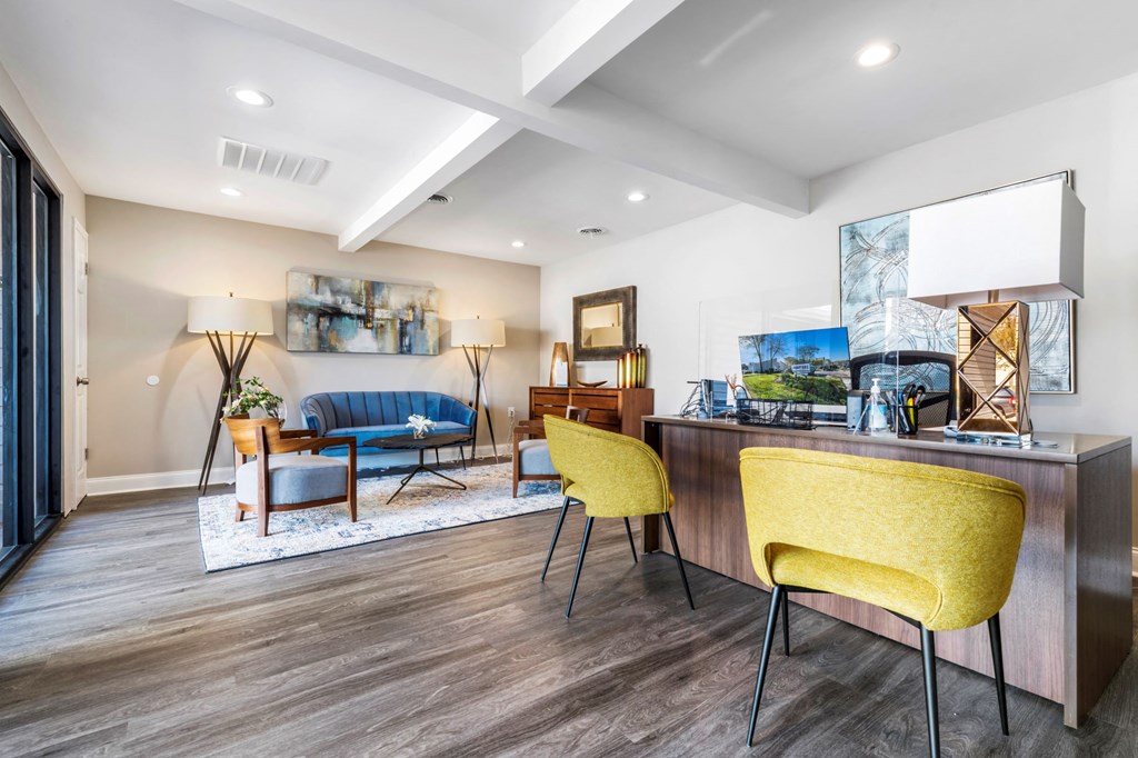 a living room with a couch and a table with chairs