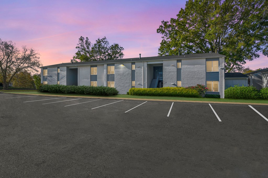 an empty parking lot in front of a building