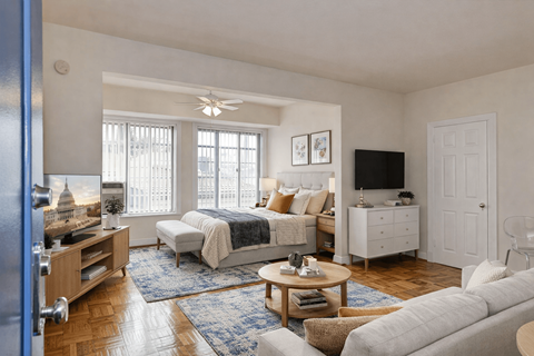A bedroom with a bed, dresser, and window.