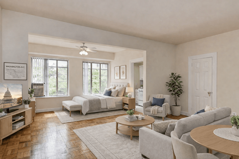A living room with a television, couches, and a coffee table.