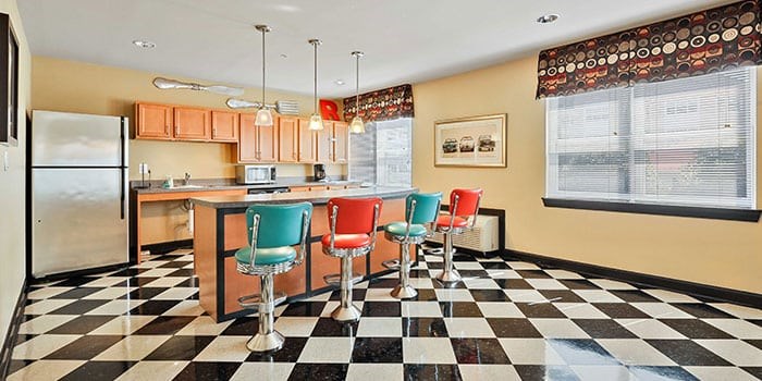 A kitchen with a black and white checkered floor at Rainier Manor Apartments, Mount Rainier, MD, 20712