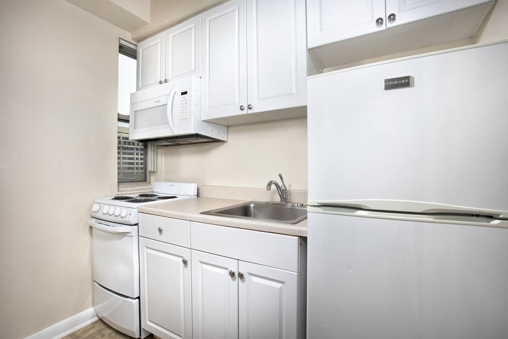 White Cabinetry And Appliances In Kitchen White Cabinetry And Appliances In Kitchen at Empire, Washington, DC, 20006
