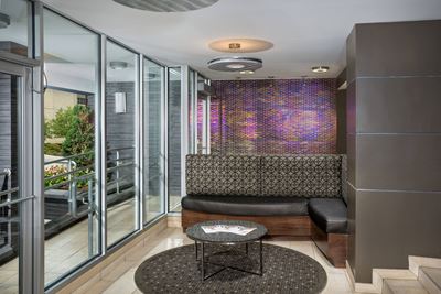 lobby with lounge benches and coffee table at Metro 710 apartments in Silver Spring, MD