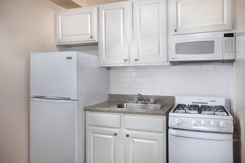 kitchen with gray counter tops at Miramar, Washington, Washington