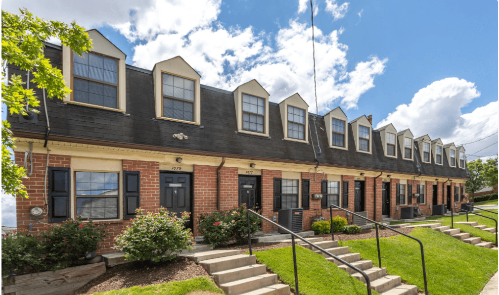 A row of houses with black shutters and red doors. A row of houses with black shutters and red doors at Dutch Village Apartments, Baltimore, 21234