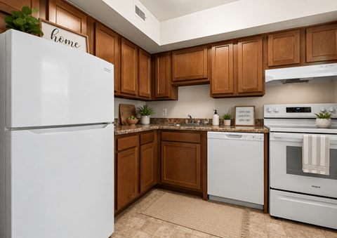 A white refrigerator is in a kitchen with wooden cabinets.