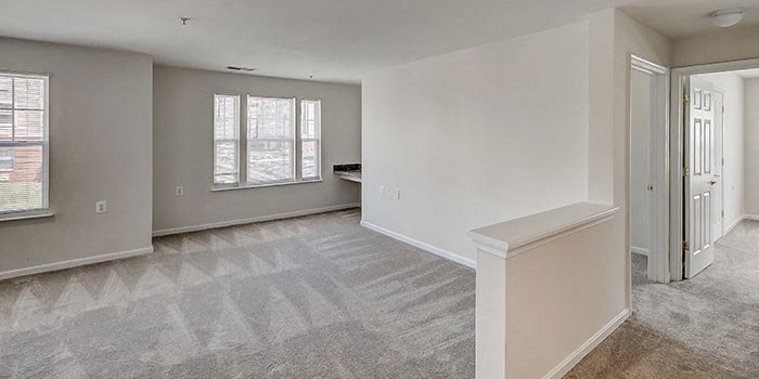 the living room and dining room of an empty house at Windsor Crossing, Suitland, MD 