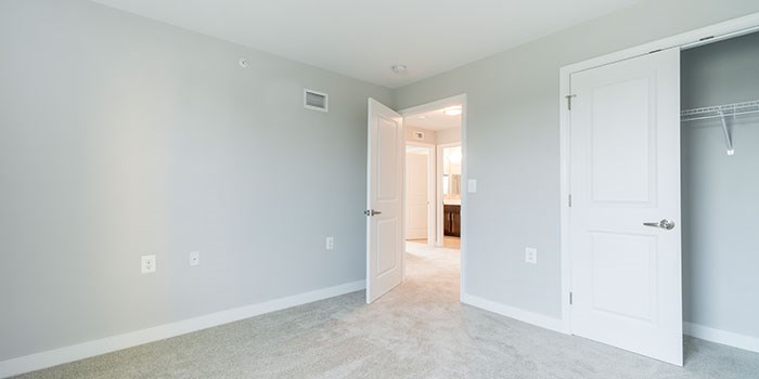 A room with a white door and a white wall. at Rainier Manor Apartments, Mount Rainier, Maryland
