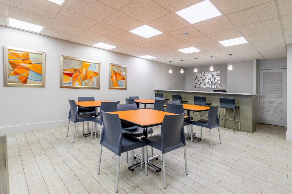 A conference room with a long table and chairs at Charlestowne North Apartments, Greenbelt