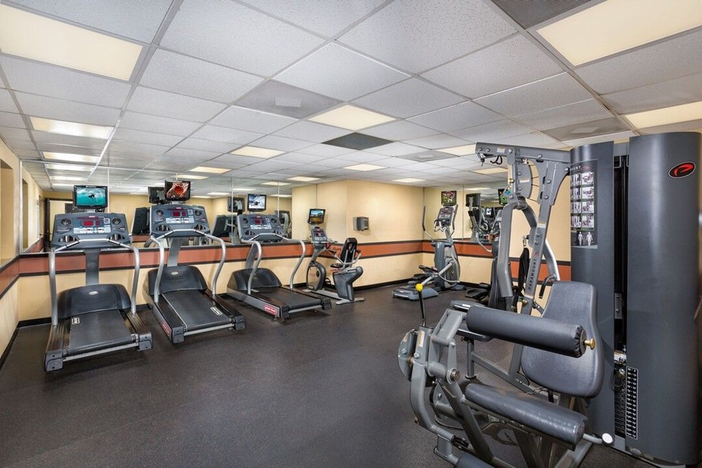 A gym with treadmills, exercise bikes, and other equipment at Charlestowne North Apartments, Greenbelt, Maryland