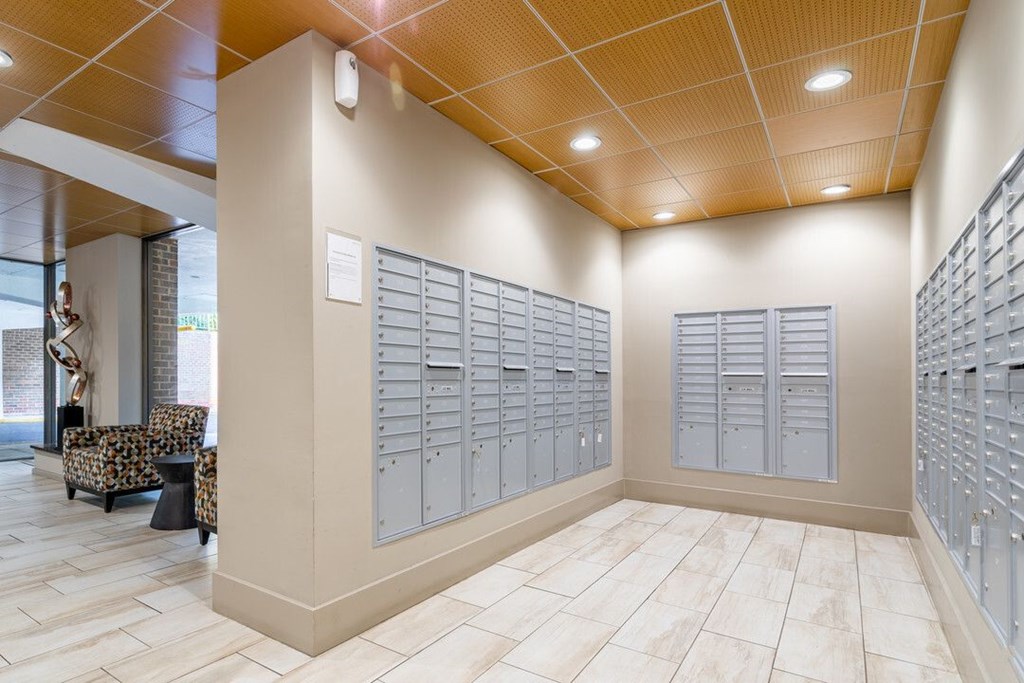 A room with a row of mailboxes on the wall at Charlestowne North Apartments, Greenbelt, MD, 20770
