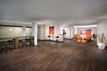 A room with wooden floors and furniture.