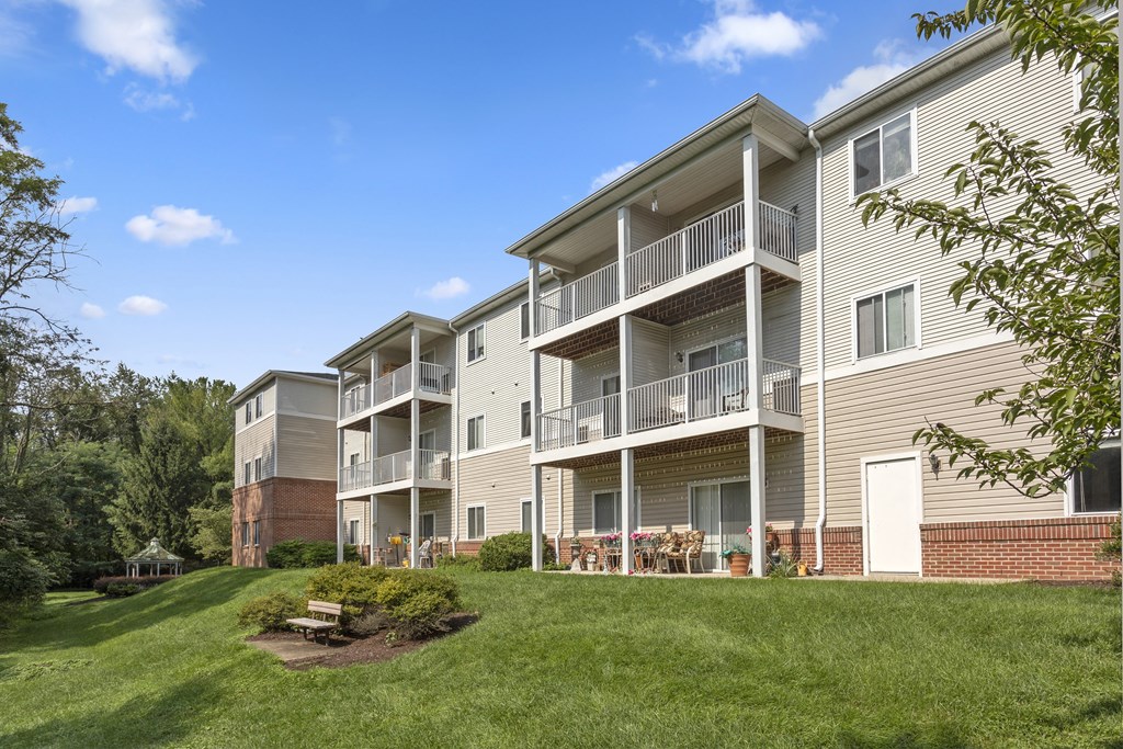 exterior of Creekside at Taskers Chance in Frederick, MD  with focus on white railings and grass