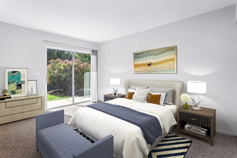 bedroom at Creekside at Taskers Chance in Frederick, MD with bed with white and blue linens, bedroom bench, nighttables and dresser