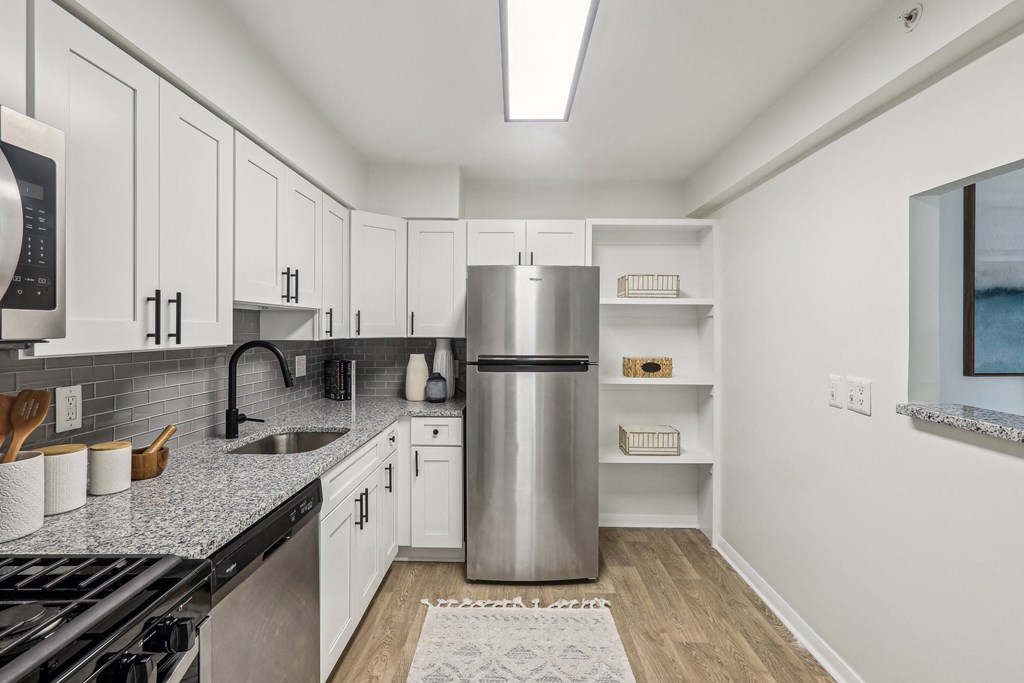 White Cabinetry And Appliances In Kitchen at Aspen at Lake Trail, Columbia, MD