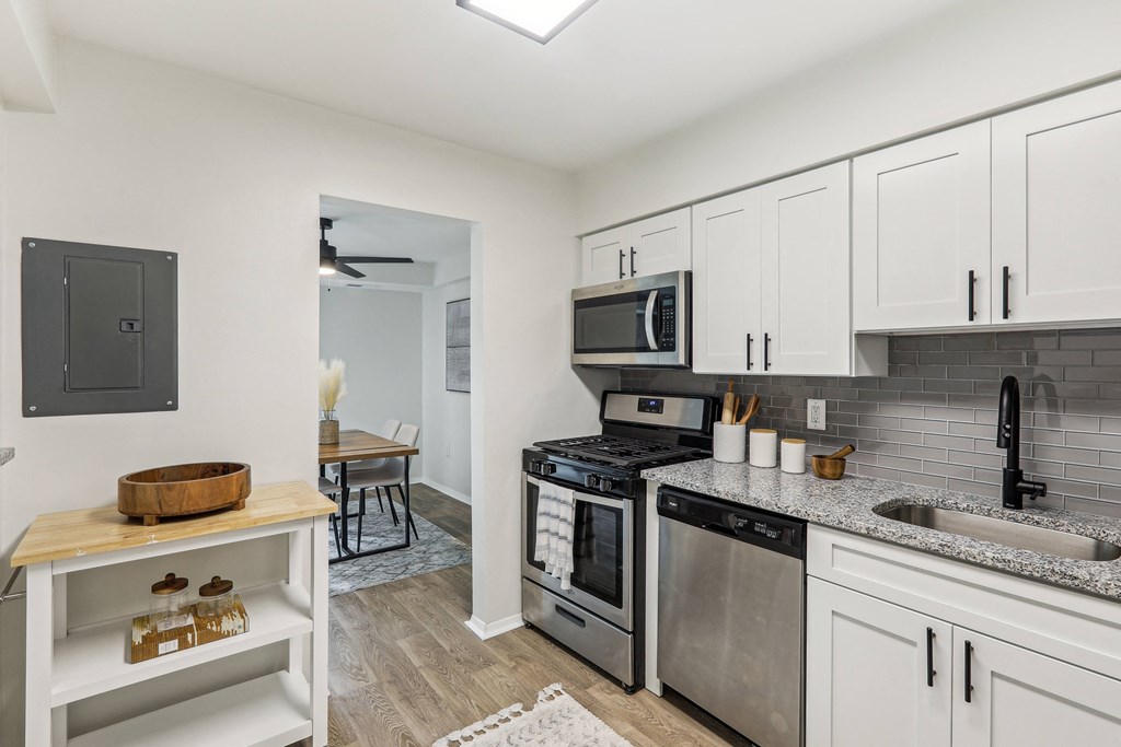 Modern kitchen with stainless steel appliances and white cabinets at Aspen at Lake Trail, Maryland, 21045