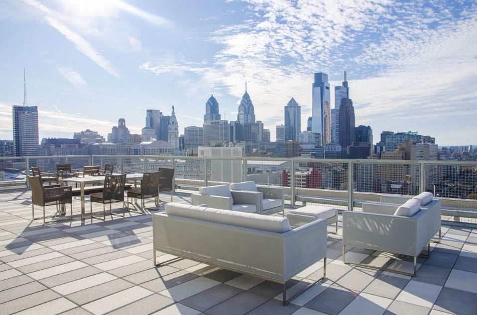 a view of the city skyline from a roof top terrace