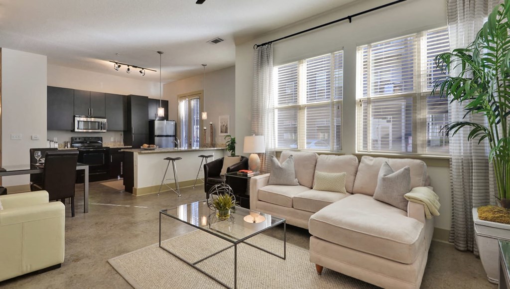 Living Room With Kitchen View at Optimist Lofts, Atlanta, GA
