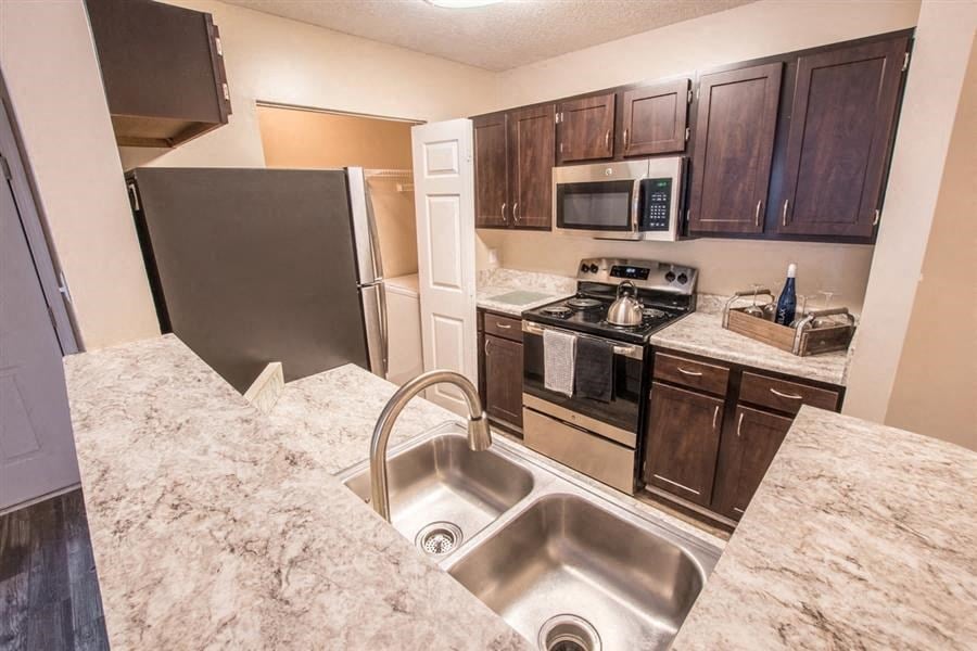Amberwood at Lochmere, Cary NC, kitchen with dark cabinets and stainless appliances