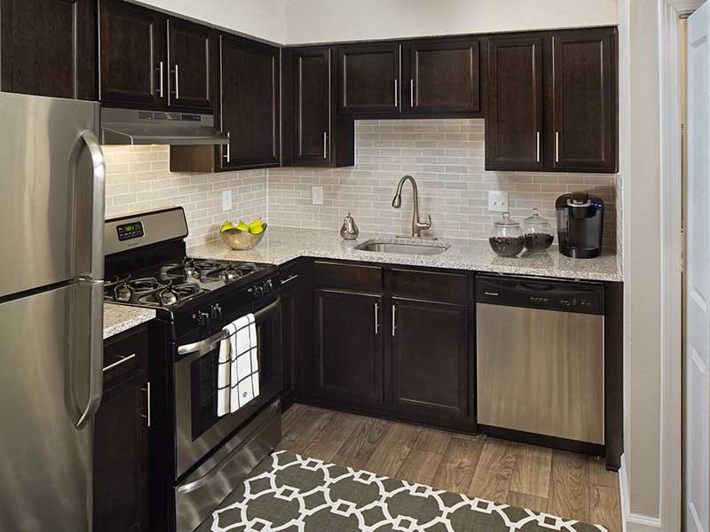 Espresso Cabinetry with Stainless Steel Appliances at Paces Ridge at Vinings 30339