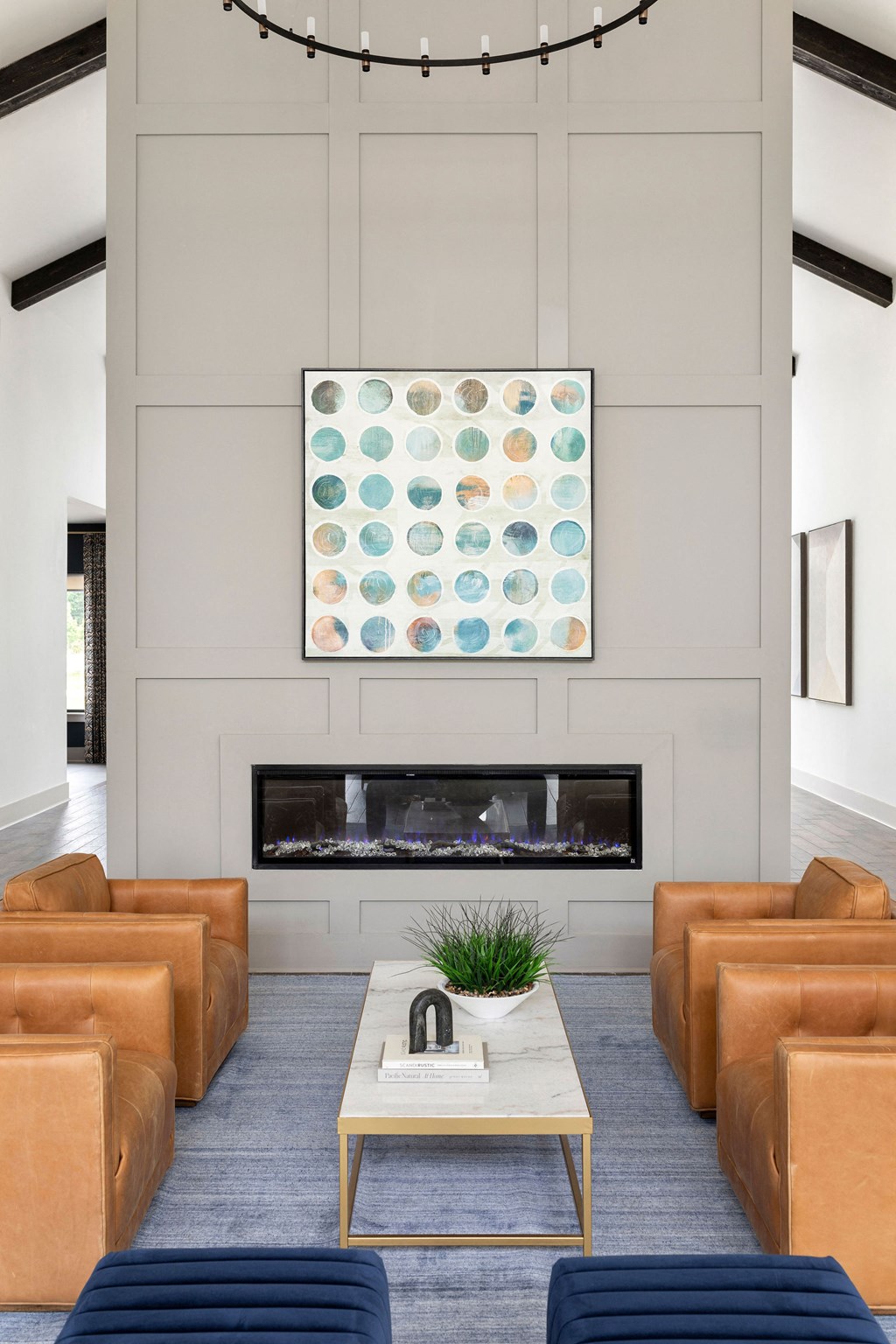 a living room with leather couches and a fireplace at The Cannon, Tennessee