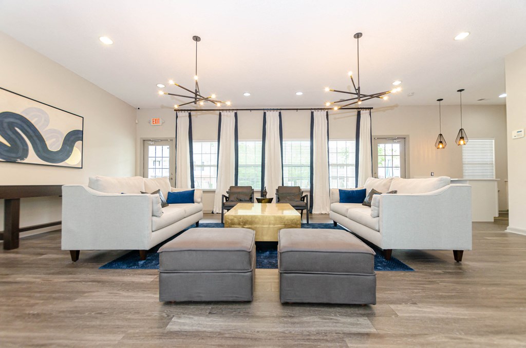 a living room with couches and chairs and a table
