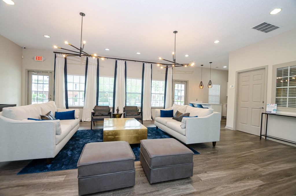 a living room with couches and chairs and a table