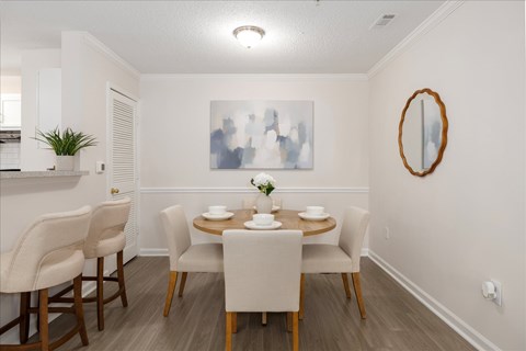 Dedicated dining area adjacent to the kitchen at The Grove at Greenleaf Apartments in Conyers, GA