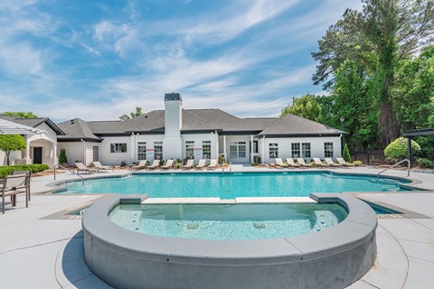 A large house with a pool in the backyard.