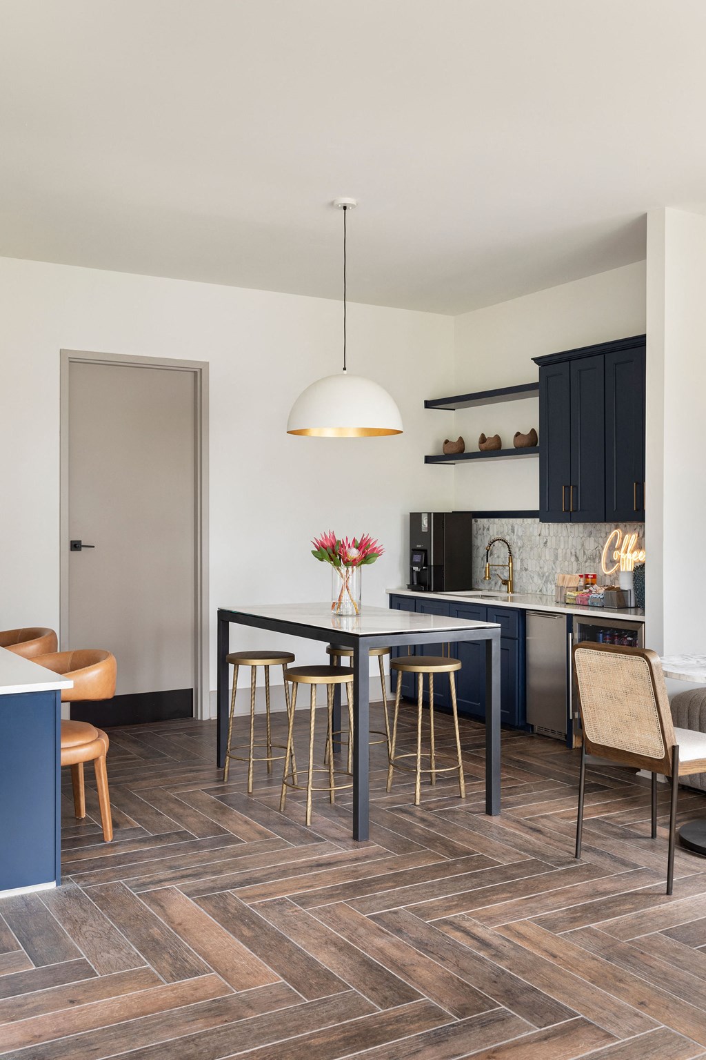 a kitchen with blue cabinets and a table and chairs at The Cannon, Murfreesboro Tennessee