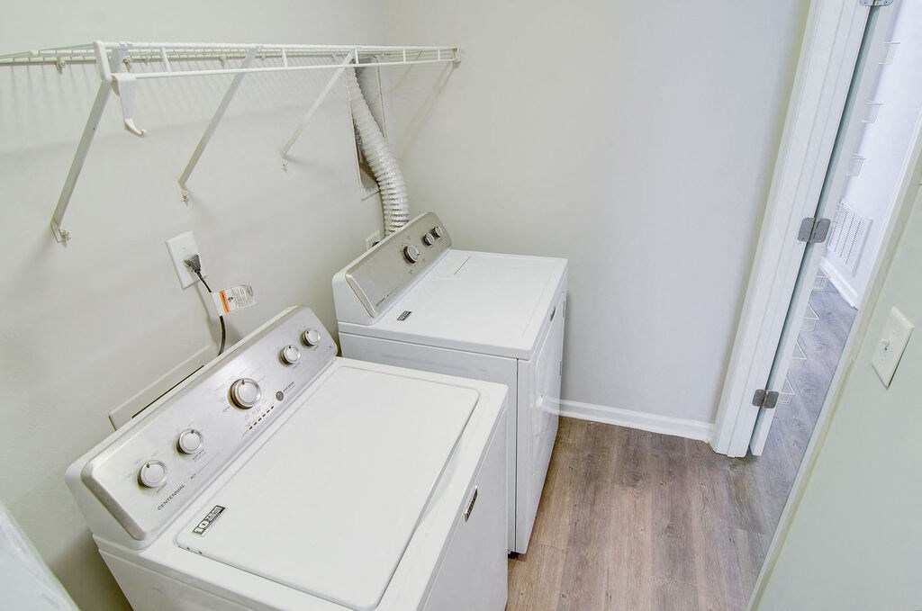 a washer and dryer in a laundry room at Enclave at West Ashley Apartments, Charleston,SC