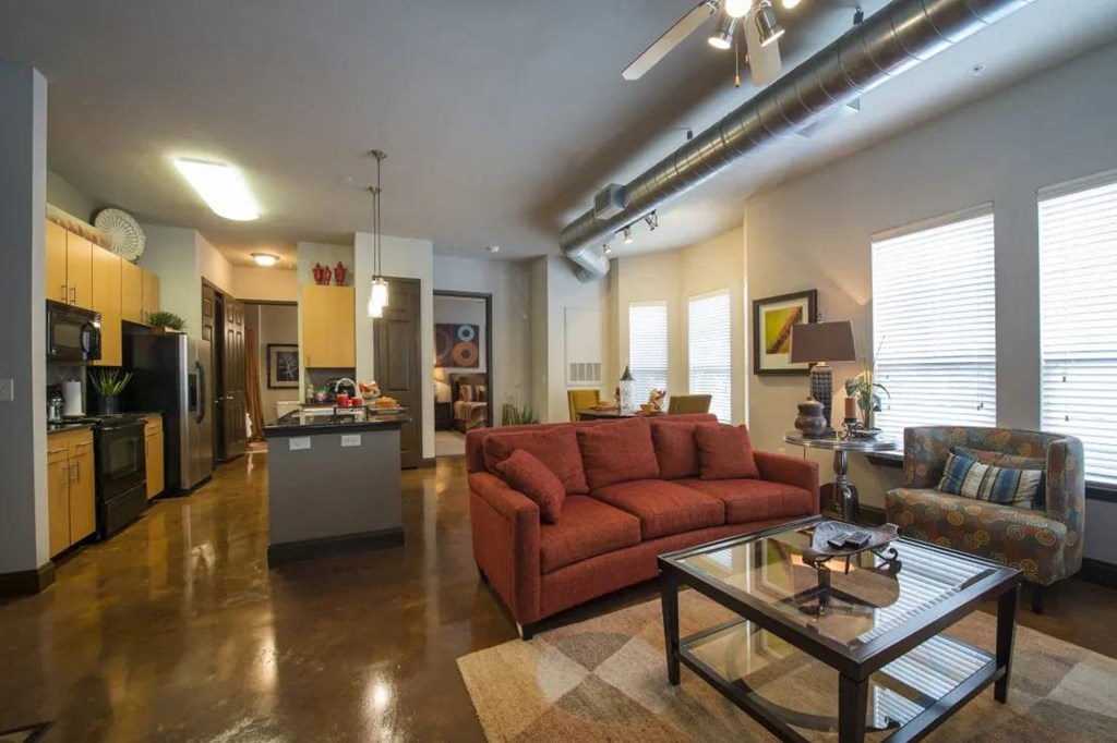 a living room with a couch and a table at Kings Cove, Kingwood, TX 77345