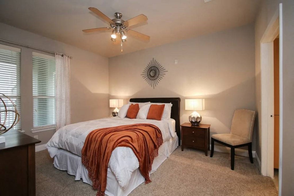 a bedroom with a bed and a ceiling fan at Kings Cove, Texas, 77345