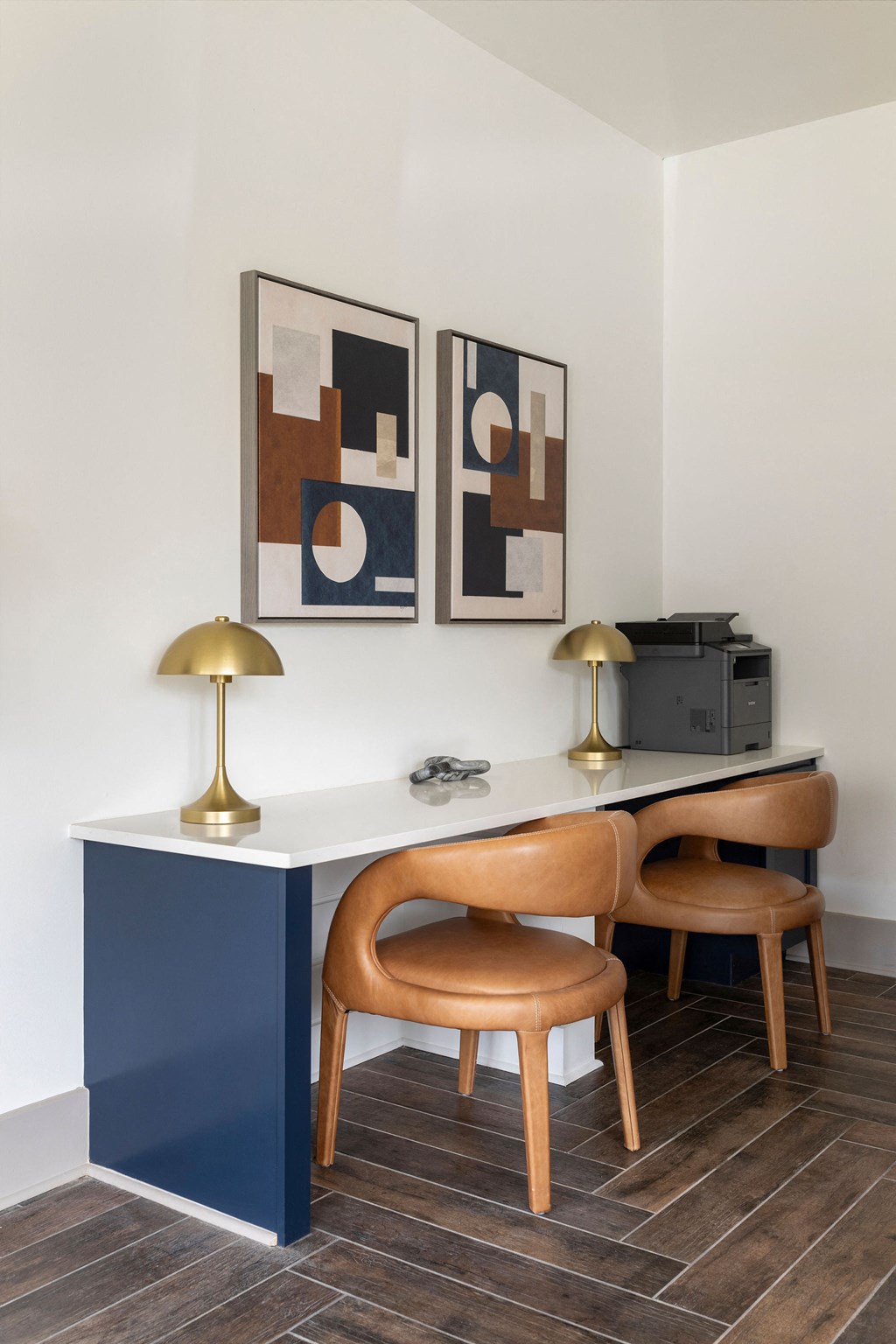 a desk and chairs in a room with paintings on the wall at The Cannon, Tennessee, 37130