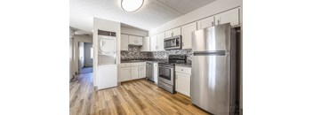 Kitchen with a refrigerator, oven, and microwave at Summit Terrace, Maine, 4106