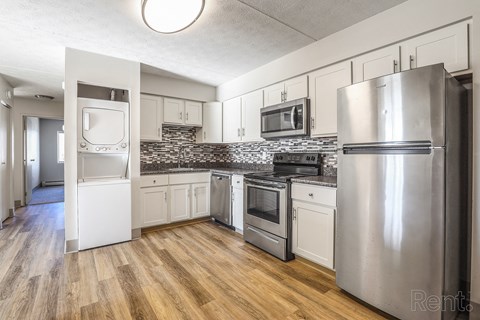 Kitchen with a refrigerator, oven, and microwave at Summit Terrace, Maine, 4106