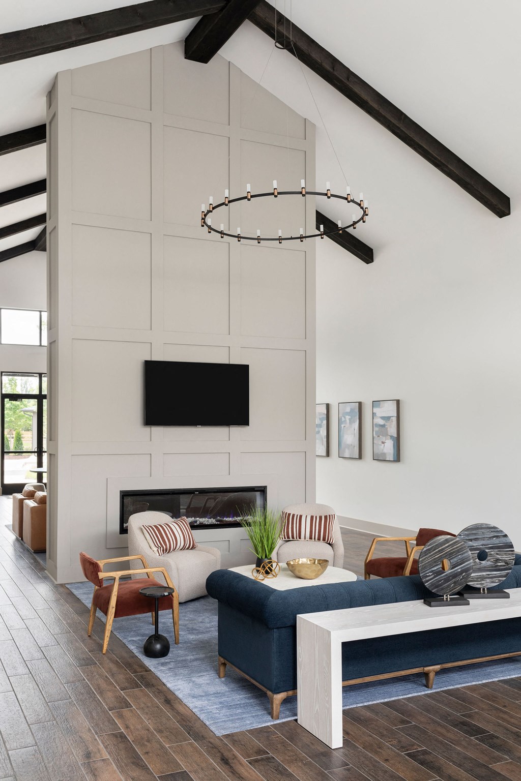 a living room with white walls and a blue couch and a fireplace at The Cannon, Murfreesboro, TN 37130