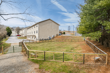 a house with a fenced in yard and a fence